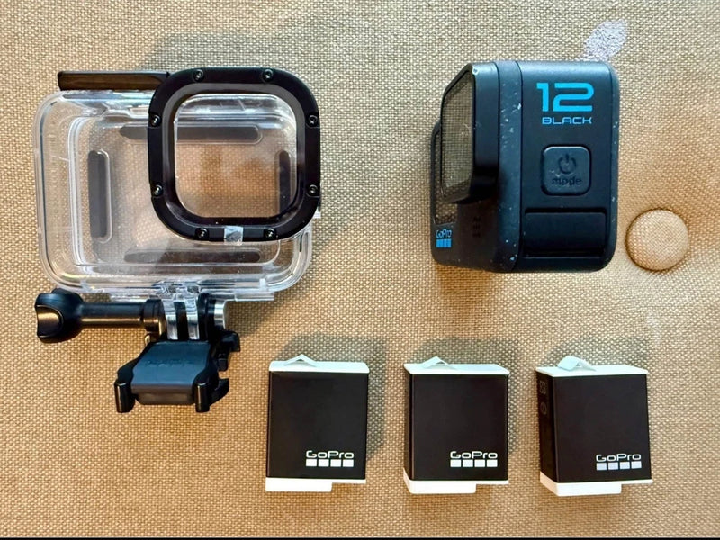 Waterproof action camera case with GoPro HERO12 Black camera and two battery packs