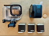 Waterproof action camera case with GoPro HERO12 Black camera and two battery packs