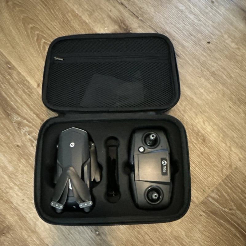 Black hard carry case with drone and remote controller inside