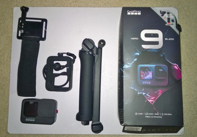 GoPro HERO 9 Black action camera bundle with wrist mount, case, and charging handle
