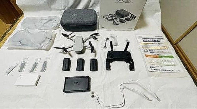 Mavic Mini drone kit with controller, prop guards, extra batteries, and hard case