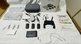 Mavic Mini drone kit with controller, prop guards, extra batteries, and hard case