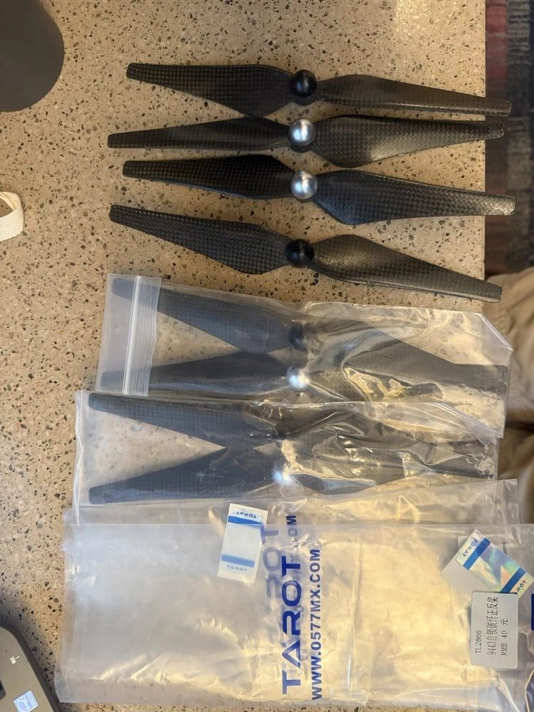 Carbon fiber drone rotor blades set in clear plastic bags, 8 blades