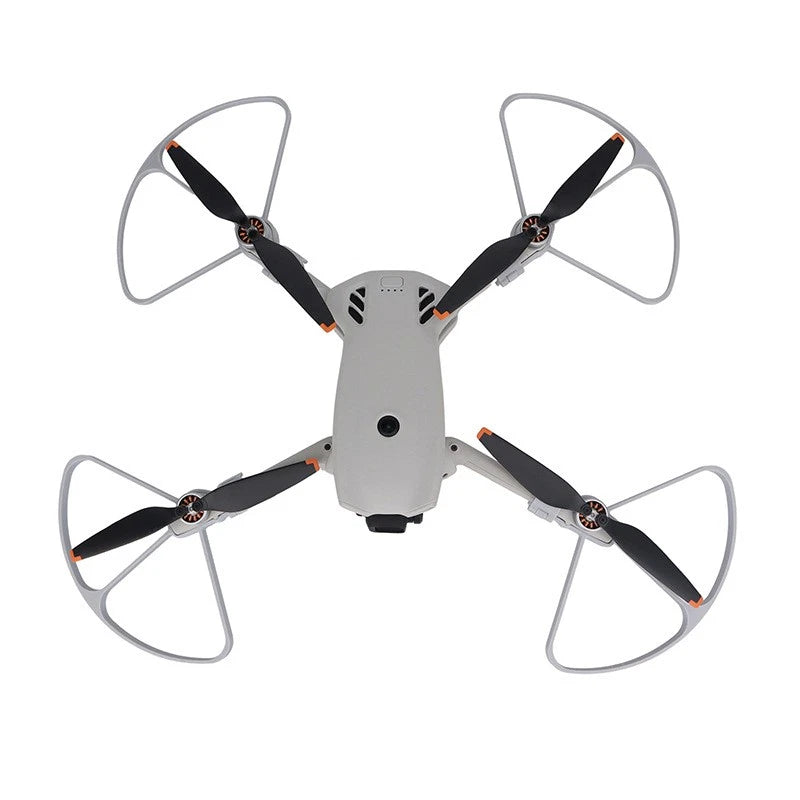 Drone with gray propeller guards and four black blades