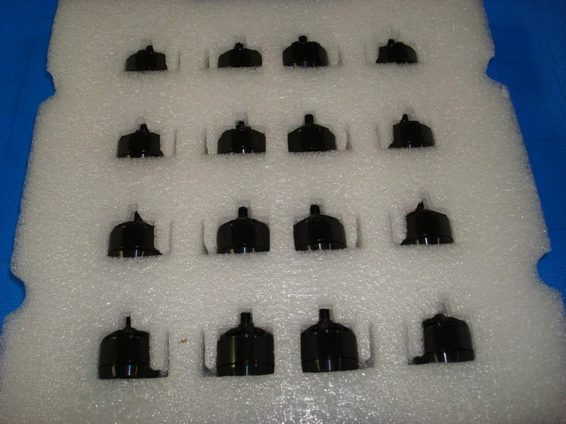 Black RC drone brushless motors with mounting hardware, shown in foam tray
