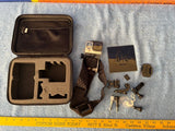 GoPro action camera accessories kit with open case, mounts, harness, and spare parts
