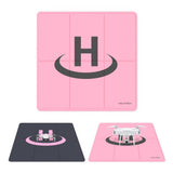 Weighted drone landing pad, pink and dark blue with circular landing ring
