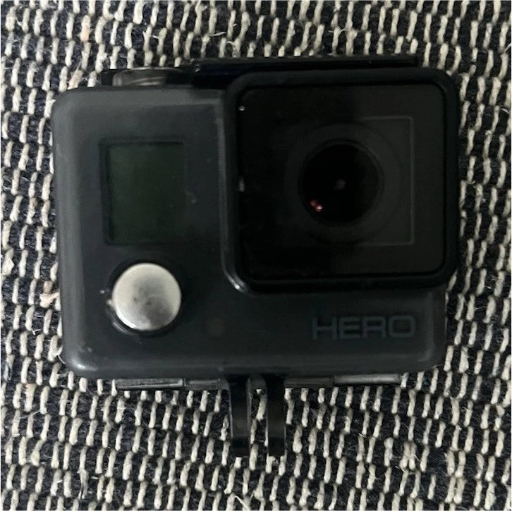 GoPro HERO action camera with front lens and HERO logo, black housing