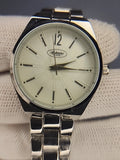 Silver-tone quartz wristwatch with black bezel, cream dial, stick markers, metal bracelet