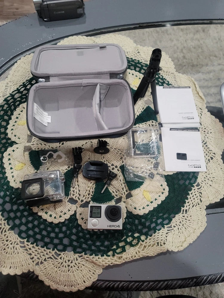 GoPro HERO4 silver action camera with accessories in a hard case and cables