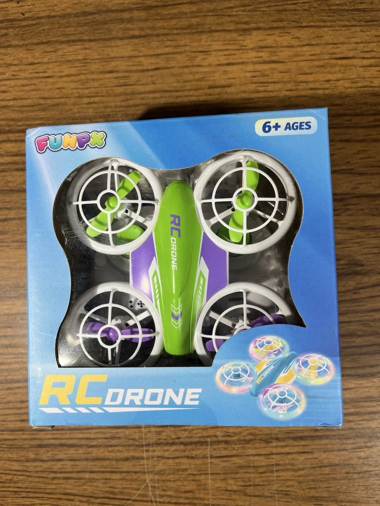 LED RC quadcopter drone toy with 4 blades, green and purple, in box