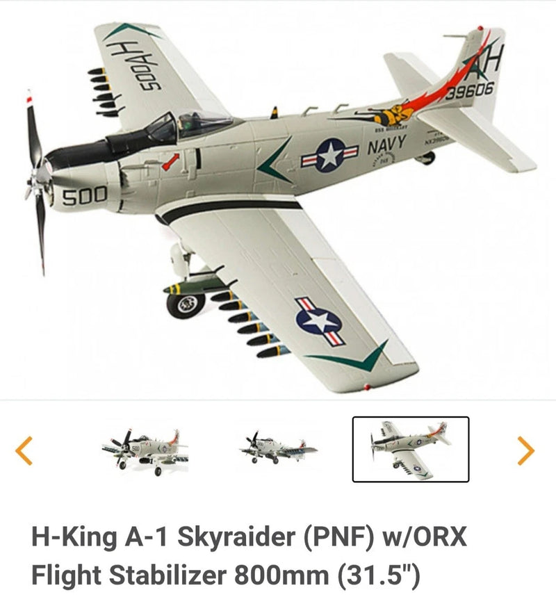 Gray and white A-1 Sky Raider RC model plane with wing-mounted details and Navy decals