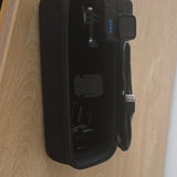 Black mini action camera in black zip case with attached mount