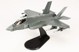 Hobby Master F-35A Lightning II model airplane on black display stand, gray jet