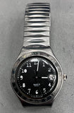 Black dial quartz wristwatch with metal ridged bracelet and date window