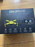Drone kit box showing yellow quadcopter and VR goggles, GOLDFINCH branding