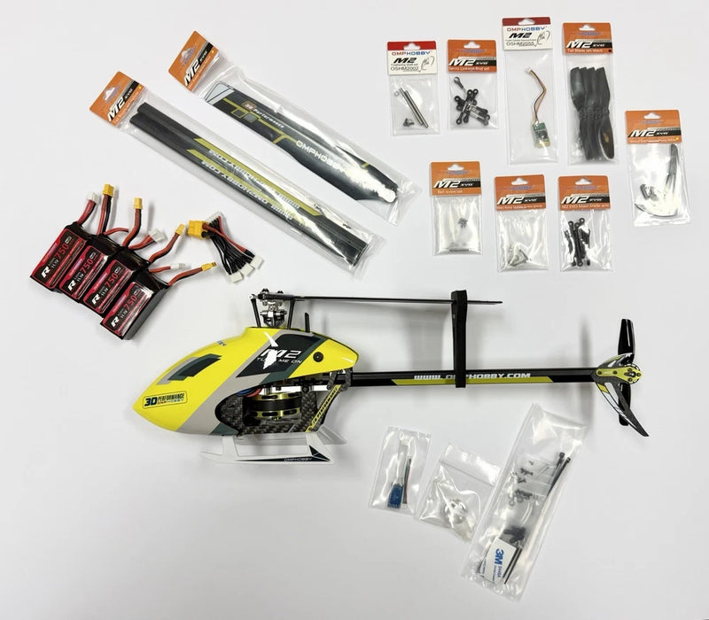 Yellow RC helicopter model with main rotor, plus spare parts in bags