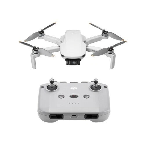 White quadcopter camera drone with controller, four propellers, front camera and sticks