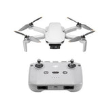 White quadcopter camera drone with controller, four propellers, front camera and sticks