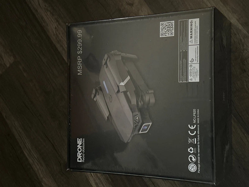 Sealed drone retail box with QR code, black and gray packaging
