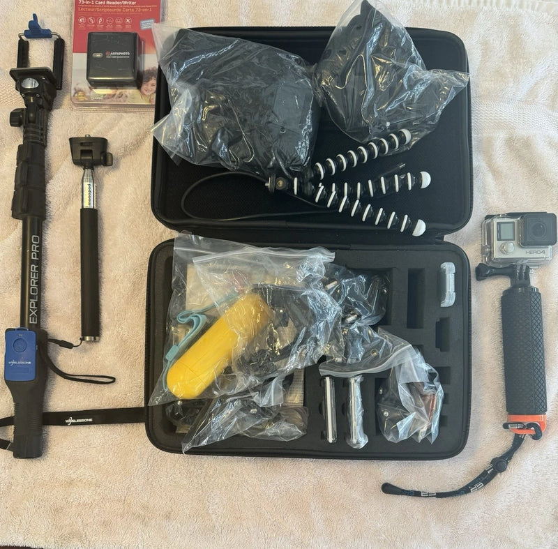 Black waterproof case kit with action camera mounts and assorted accessories