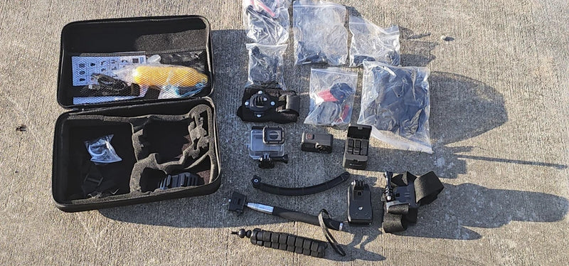GoPro HERO7 Black action camera bundle with open case, mounts, and accessories