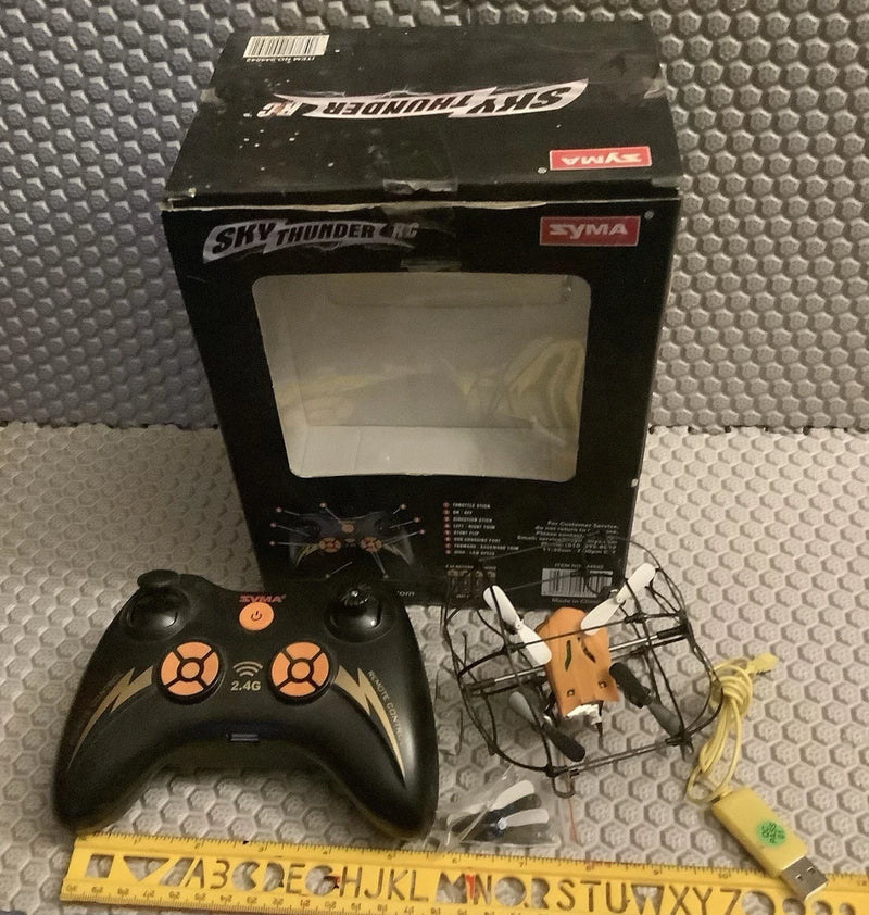 RC drone RTF kit in sealed box with controller and parts, black and white