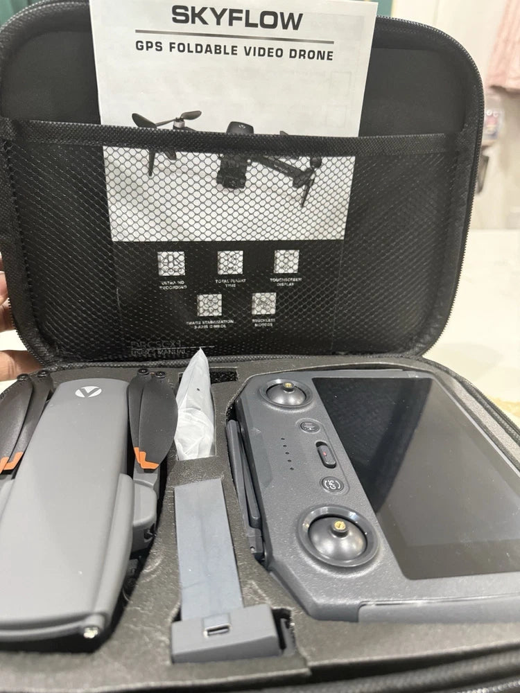 GPS foldable video drone with 4K, gray body and camera module in carry case