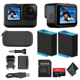 Black waterproof action camera with front LCD, plus case, mounts, cable, and SanDisk microSD card
