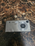 Silver HP PhotoSmart M307 3.2MP compact digital camera with lens and HP logo