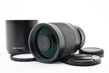 Kenko MC mirror lens with ribbed barrel, lens hood, and front cap