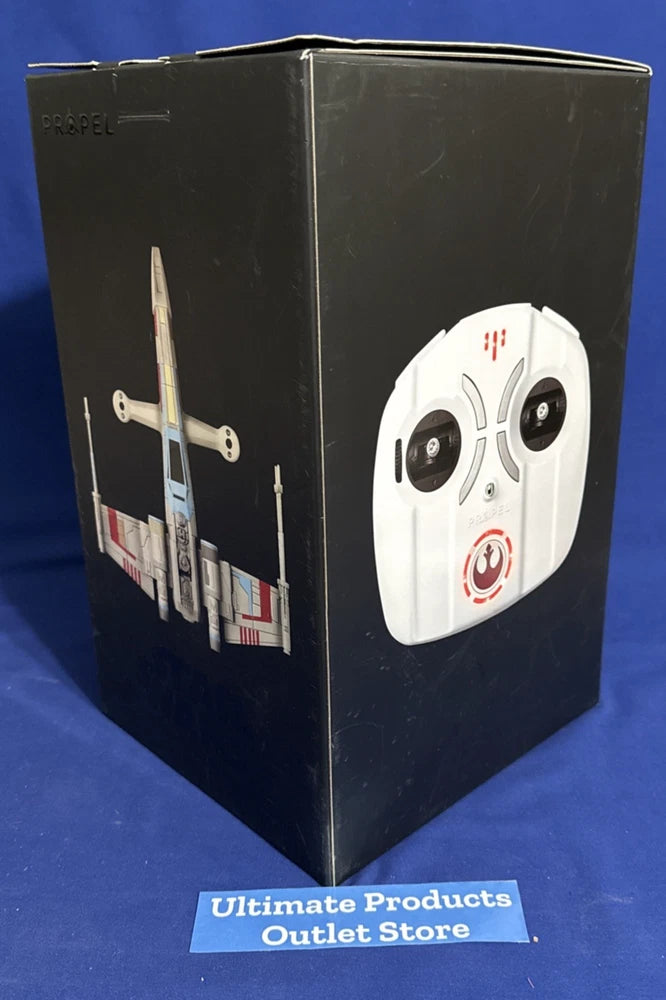 Black collectible drone packaging box with X-wing style illustration and control panel graphic