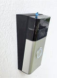 Battery doorbell with black front and clear lens, wall-mounted vertical wedge