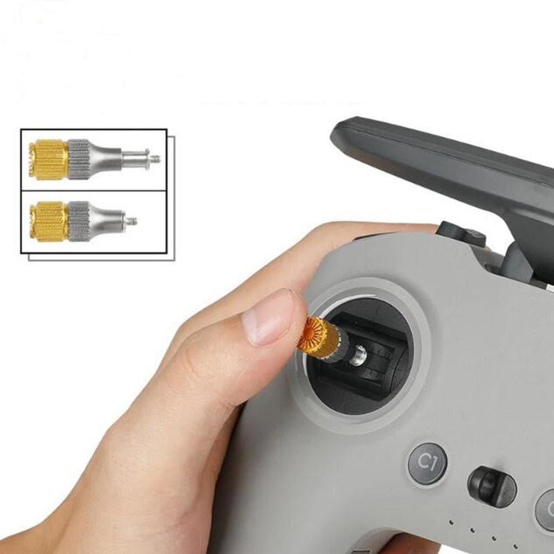 Telescopic joystick accessory with gold two-tone thumb grip on remote control