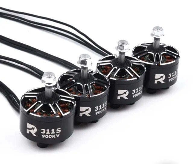 Four RC brushless motors with black housings, silver shafts, and wiring