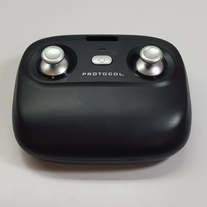 Black drone remote control with dual silver joysticks and PROTOCOL button panel