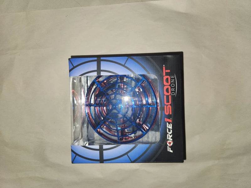 Hand-operated UFO flying drone in retail box, blue and red
