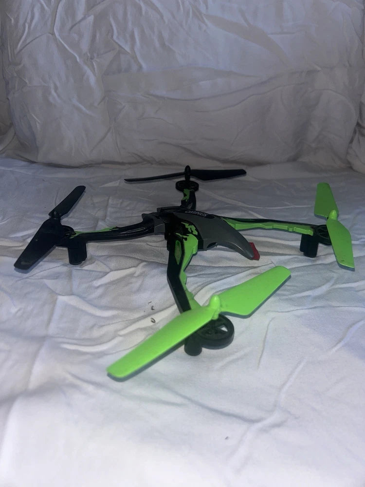 Black and green quadcopter drone with four propellers
