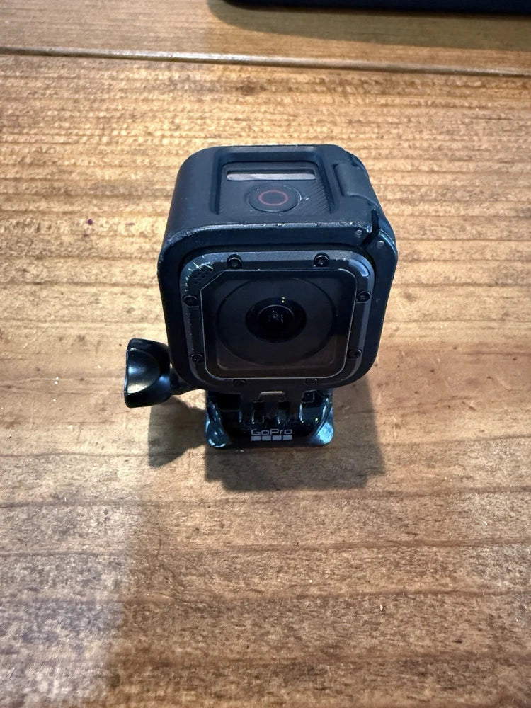 Waterproof action camera with front lens and blue protective housing