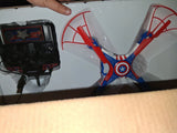 Micro RC drone with Captain America shield emblem and red blue propeller arms