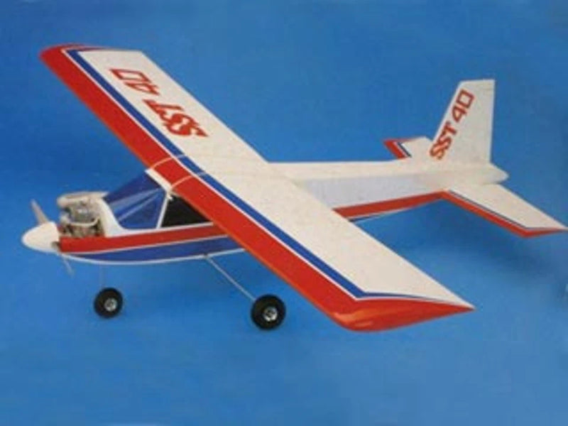 Red, white, and blue RC airplane model with wheels, printed plan graphics