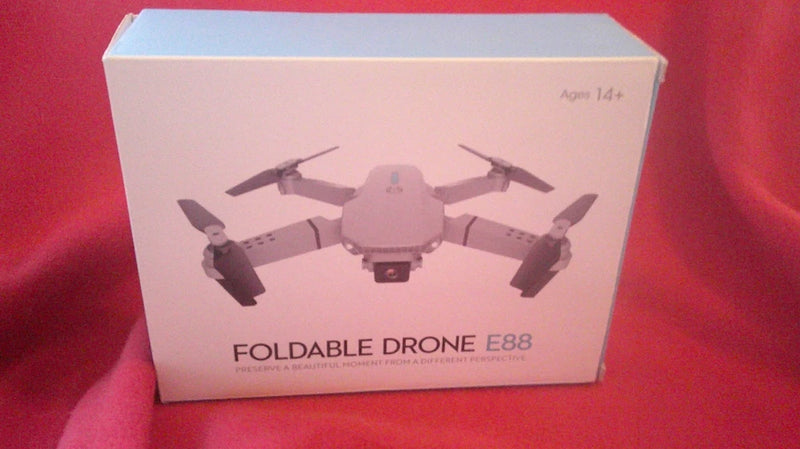 Foldable drone E88 on retail box, with drone illustration and Age 14+ label