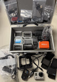 GoPro Hero3 action camera kit, silver camera and assorted accessories in carrying case