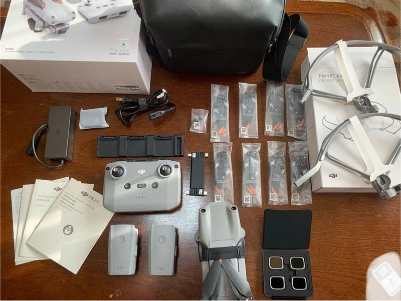 DJI Air 2S drone kit with controller, batteries, propellers, and accessories