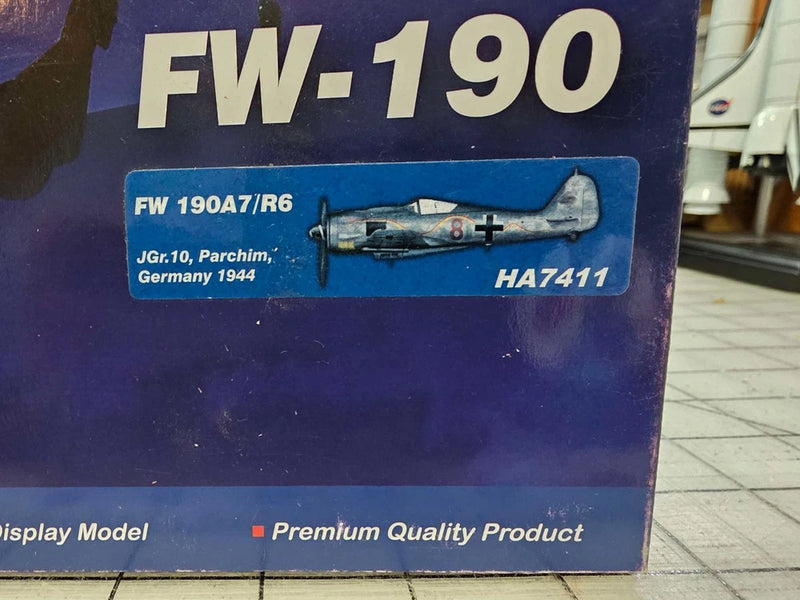 Blue model aircraft display box labeled FW-190A7/R6 with aircraft illustration