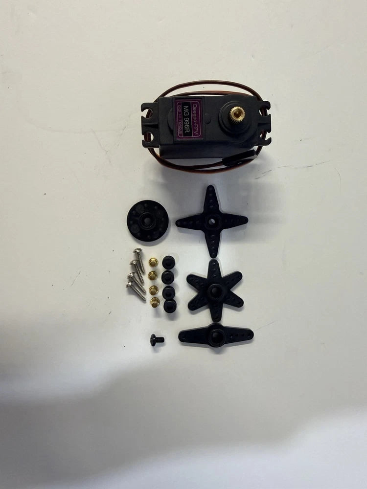 RC servo motor with mounting horn and accessory screws, wires, and black parts