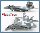 Grey F-22A Raptor scale model aircraft with landing gear, shown in two angles