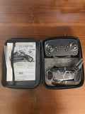 Foldable drone case with controller and visible drone parts