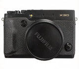 Black Fujifilm FinePix X30 digital camera with textured grip and capped lens