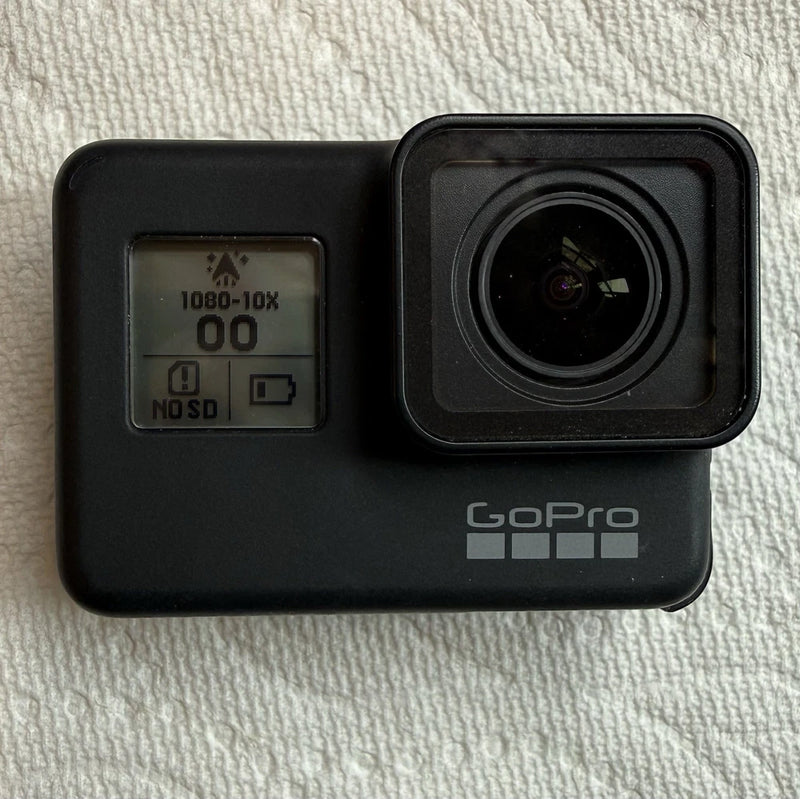 Black GoPro Hero 7 action camera front with wide lens and status screen